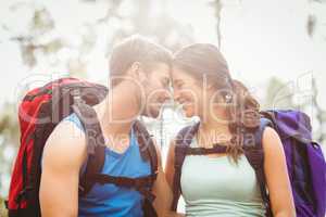 Young happy joggers touching foreheads