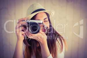 Pretty hipster using her vintage camera