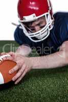 American football player scoring a touchdown