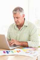 Attentive businessman working on a laptop