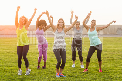 Happy sporty women dancing during fitness class