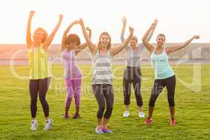 Happy sporty women dancing during fitness class