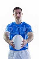 Rugby player handing a rugby ball