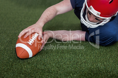 American football player scoring a touchdown