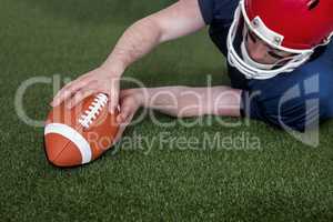 American football player scoring a touchdown