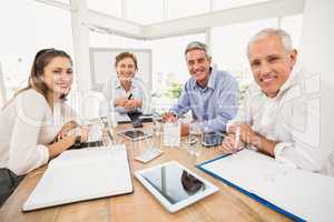 Smiling business people during a meeting