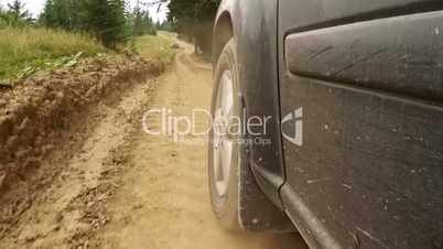 Offroader Rides on a Dusty Dirt Road