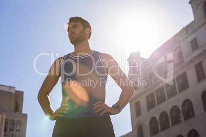 Handsome athlete with hands on hips