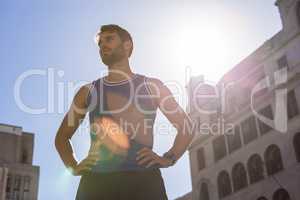 Handsome athlete with hands on hips