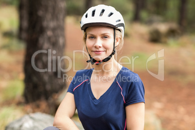 Young pretty happy biker looking at camera