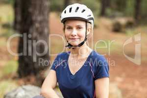 Young pretty happy biker looking at camera