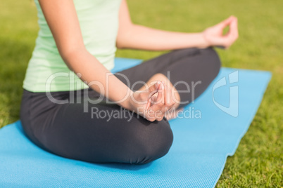 Sporty woman meditating