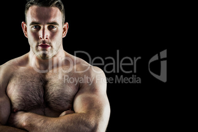 Handsome bodybuilder with arms crossed