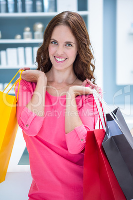 Pretty woman holding shopping bags