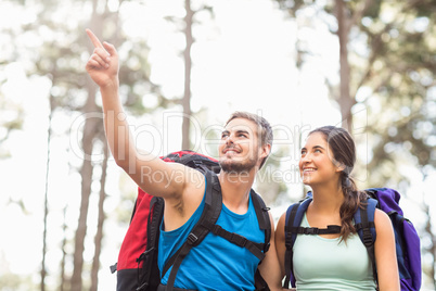 Young happy joggers looking at something in the distance