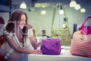 Pretty woman shopping for bags
