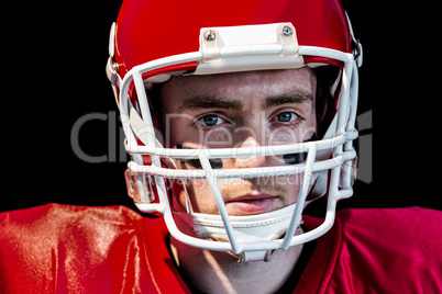 Portrait of american football player wearing his helmet