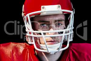 Portrait of american football player wearing his helmet
