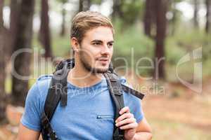 Young handsome hiker looking away