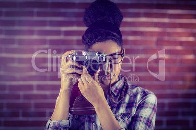 Young hipster taking a picture