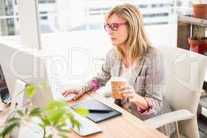Casual designer working on computer