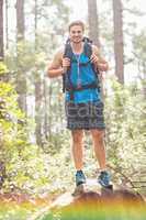 Happy hiker looking at camera