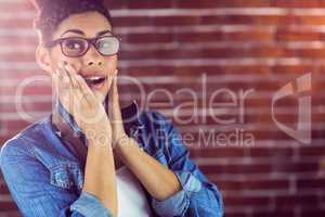 Portrait of a hipster surprised with her camera