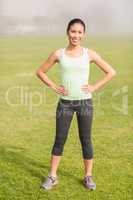 Smiling sporty woman posing