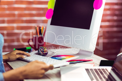 Graphic designer working at desk