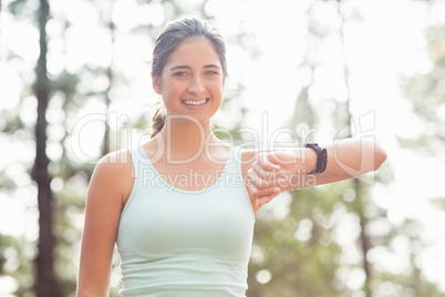 Happy jogger looking camera