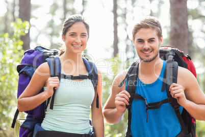 Happy joggers looking at camera