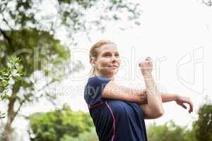 Athletic woman doing arms stretching