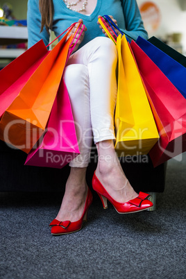 Woman holding many shopping bags