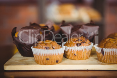 Chocolate chip muffins on cutting board