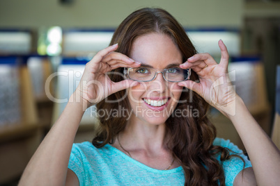 Woman shopping for new glasses