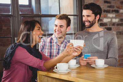 Group of friends looking at a smartphone