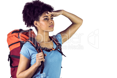 Young woman with backpack looking away