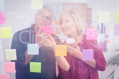 Thoughtful business team looking at a post it