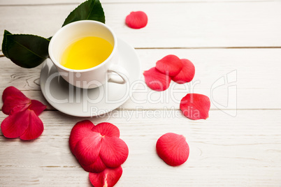 Cup of herbal tea on table