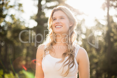 Young happy jogger looking at something in the distance