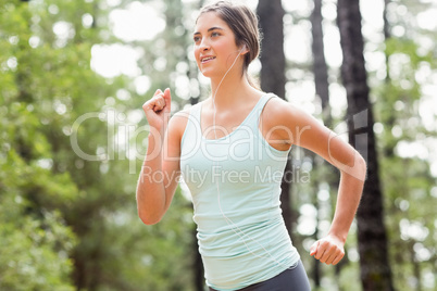 Happy jogger running and listening to music