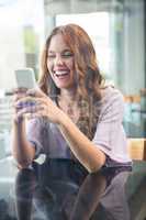 Pretty brunette sending a text