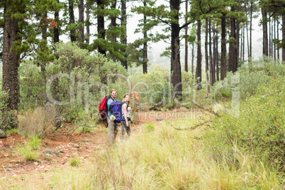 Young hiker couple hiking