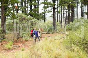 Young hiker couple hiking