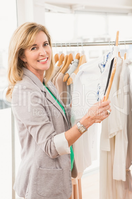 Smiling woman browsing clothes