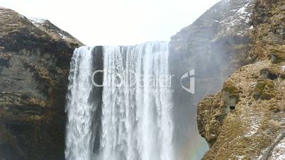 Waterfall Seljalandsfoss with rainbow in Iceland