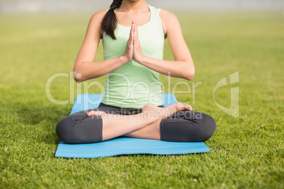 Sporty woman doing the lotus pose