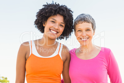 Two sporty women smiling at camera Two sporty women smiling at camera