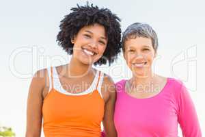 Two sporty women smiling at camera