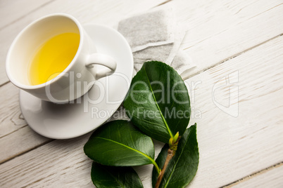 Cup of herbal tea on table